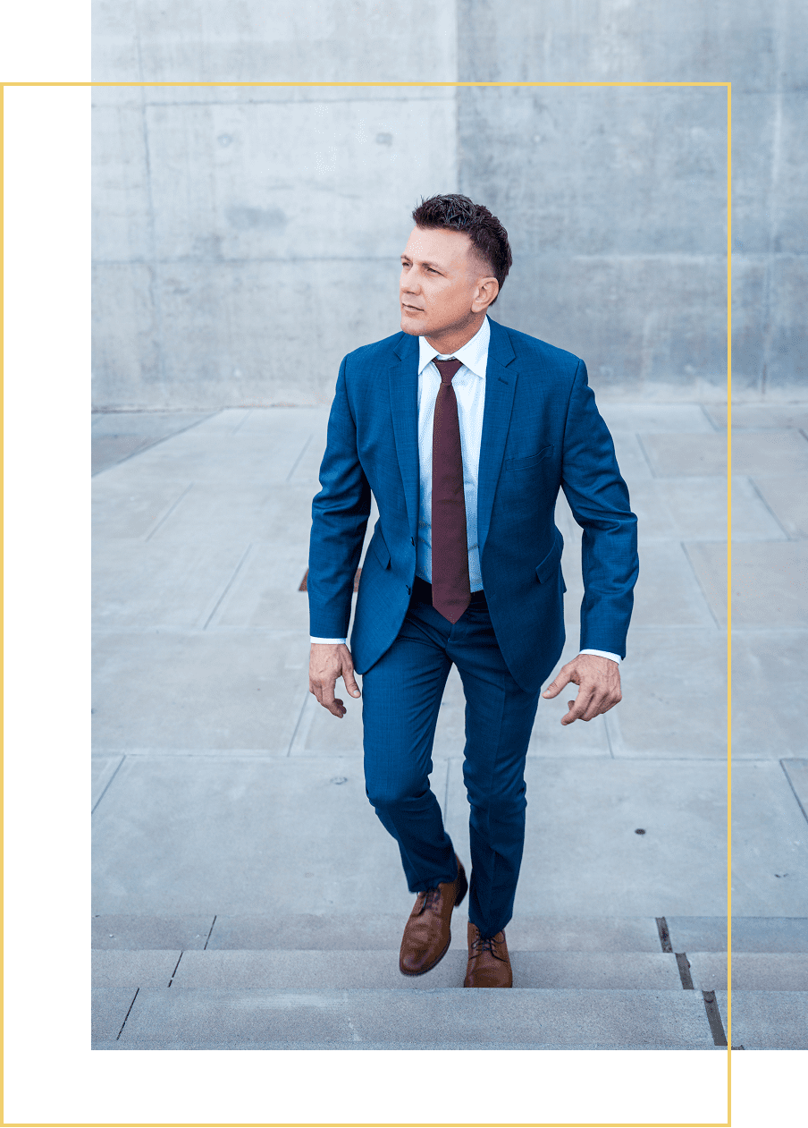 Businessman in blue suit ascending stairs