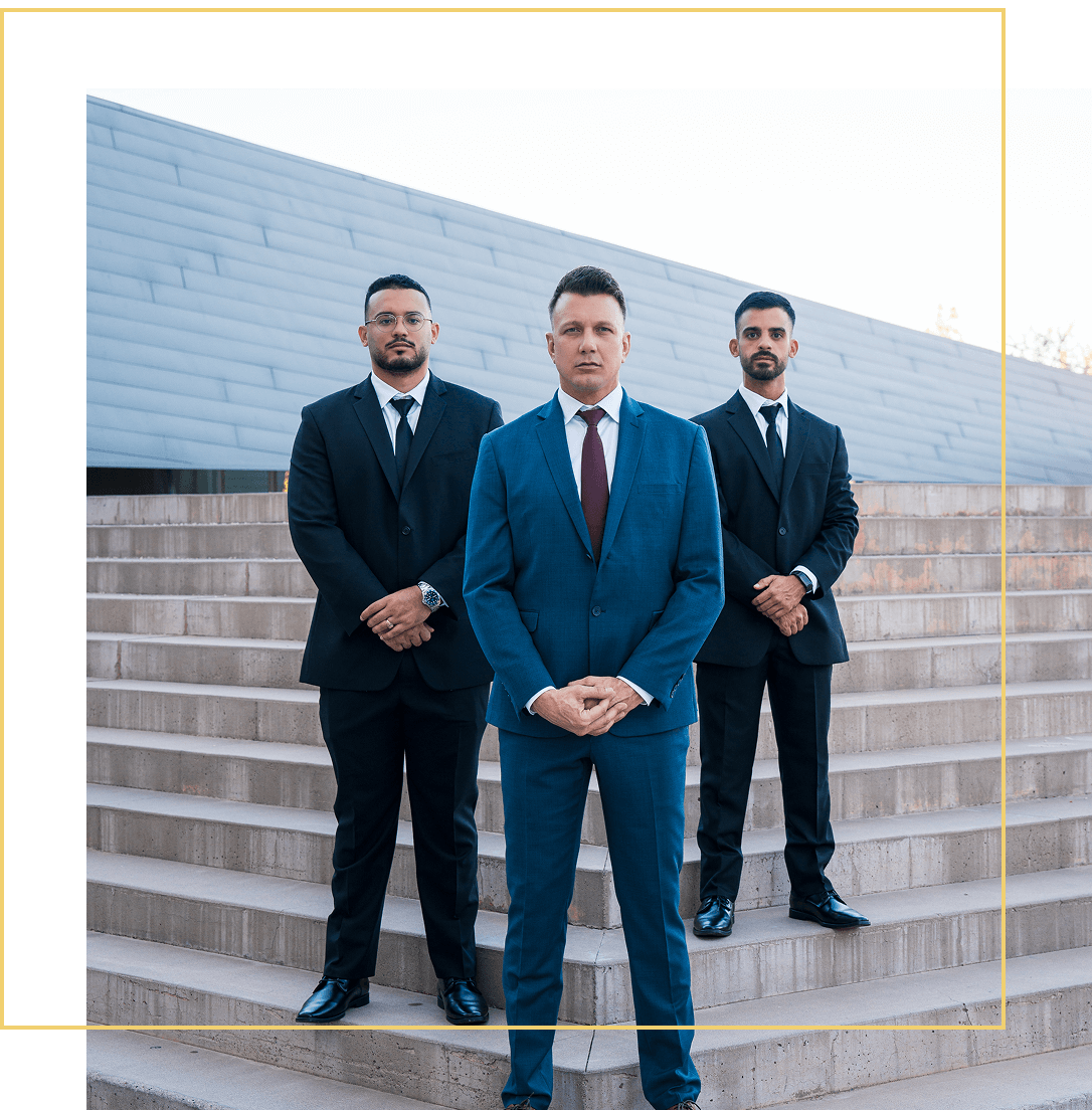 Businessmen standing confidently on stone steps