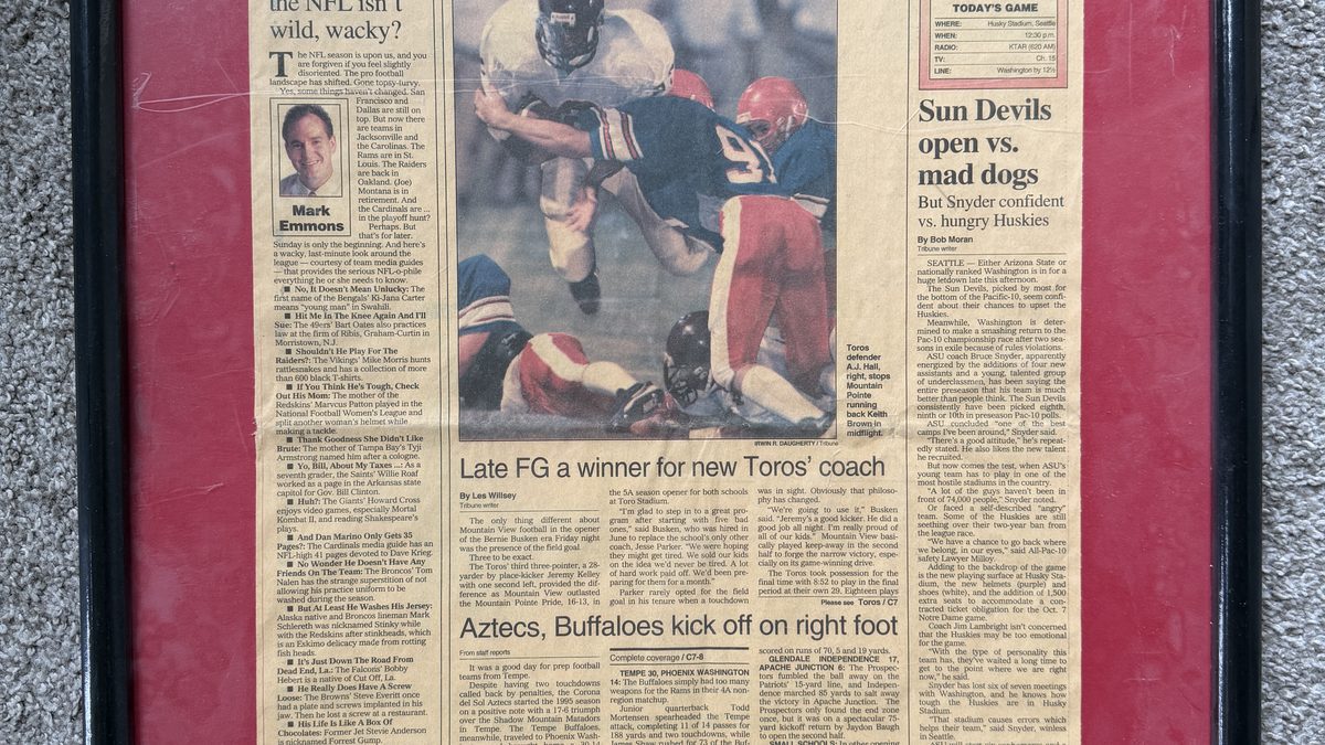Framed newspaper clipping of AJ Hall playing football for Mountain View High School in Mesa, Arizona