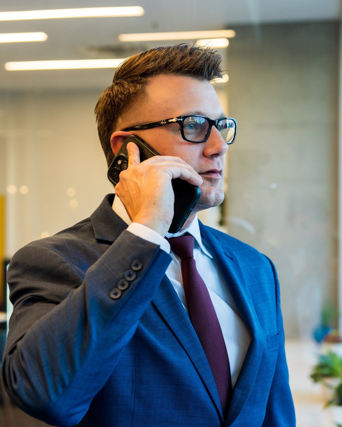 Attorney AJ Hall on a phone call at the AJ Hall Injury Law Team office in Phoenix