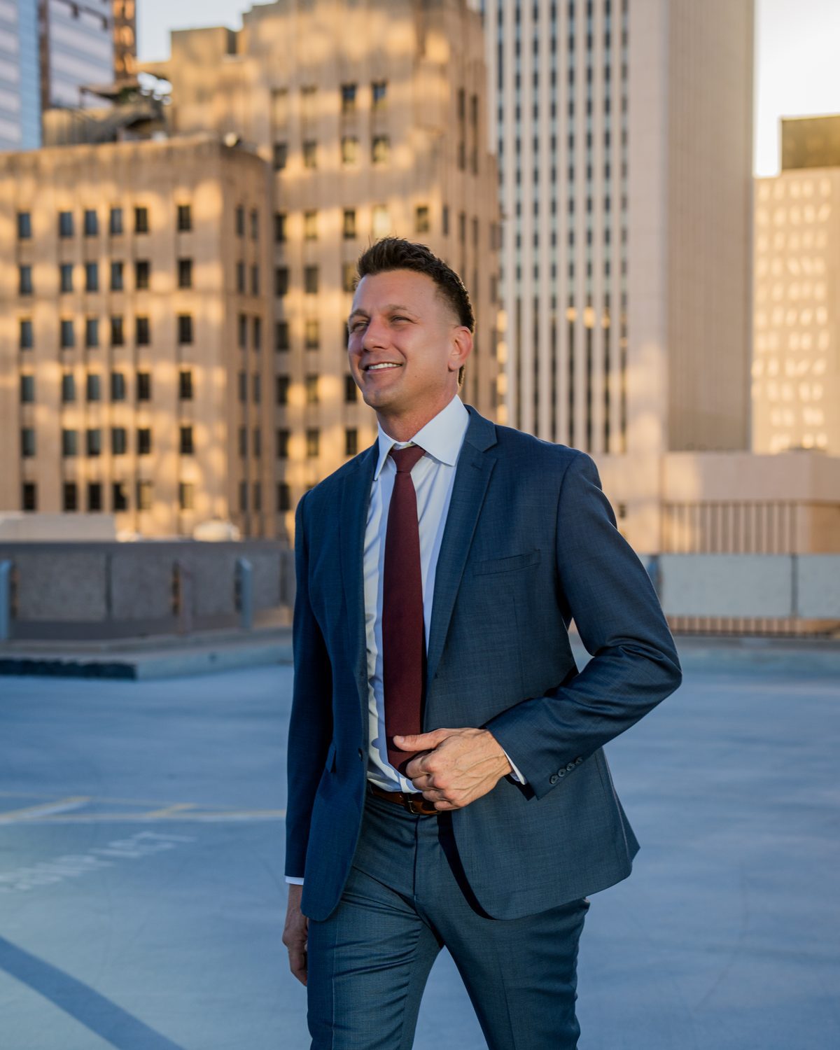 Attorney AJ Hall of AJ Hall Injury Law Team on a rooftop in downtown Phoenix