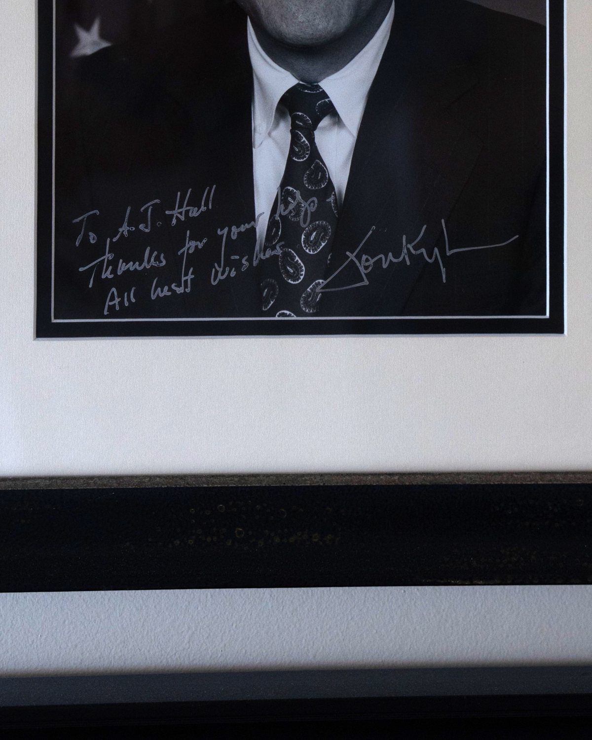 Senator Jon Kyl's handwritten inscription to AJ Hall: To A.J. Hall, Thanks for your help, All best wishes, Jon Kyl