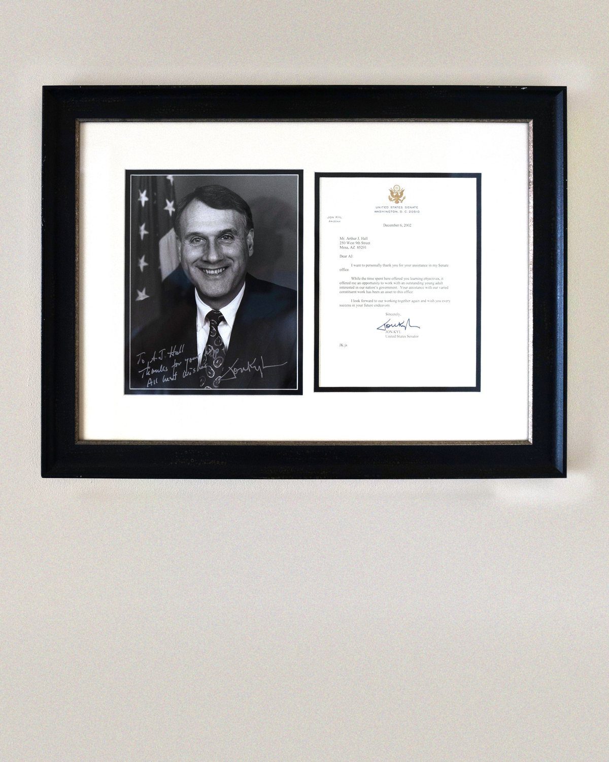 Framed signed photo of Senator Jon Kyl and his December 6, 2002 letter to AJ Hall, hanging in AJ Hall's home office